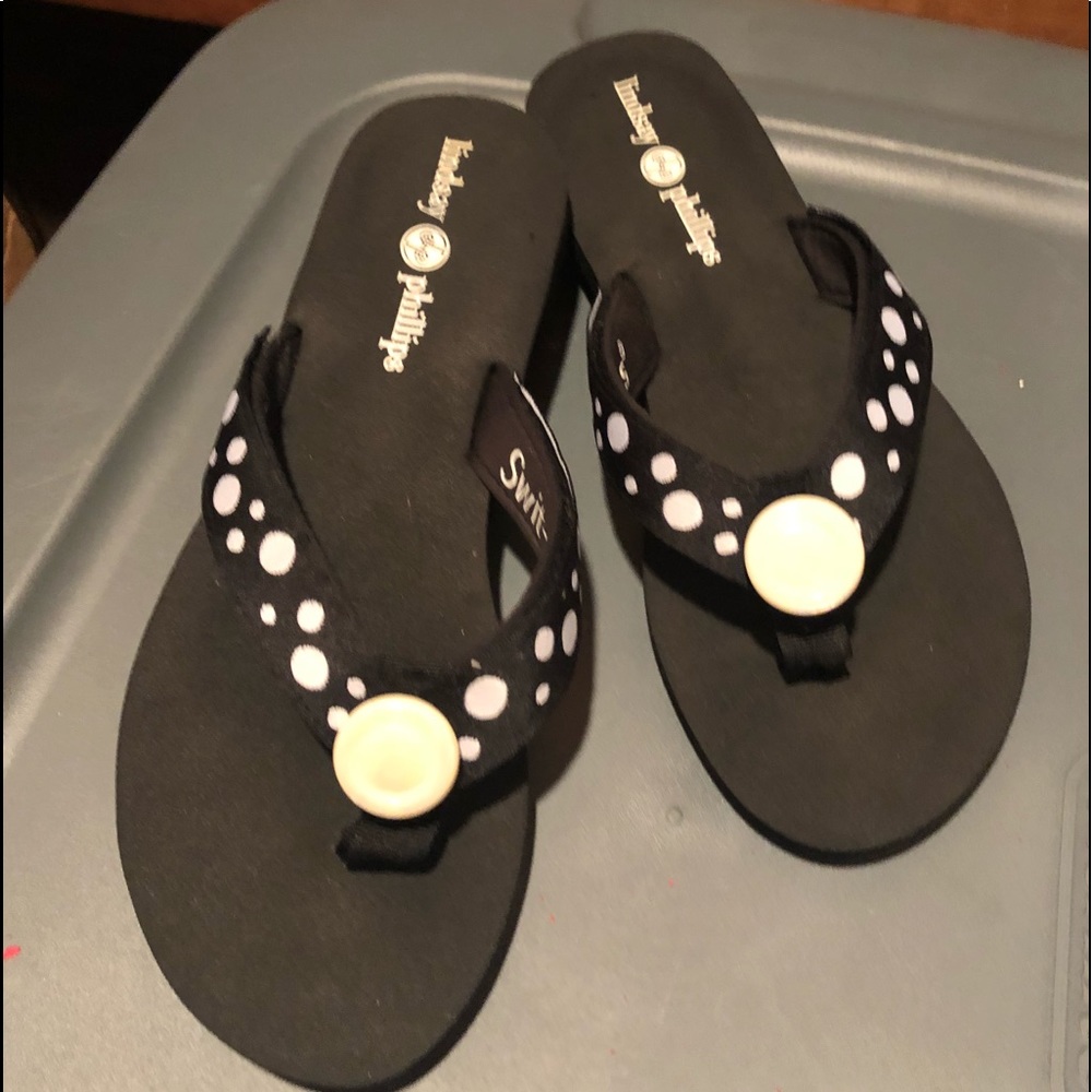 Black flip-flops with white polkadots. Never worn